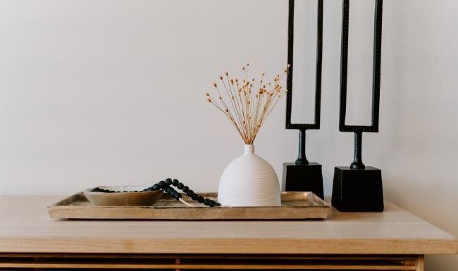 a vase with flowers on a table